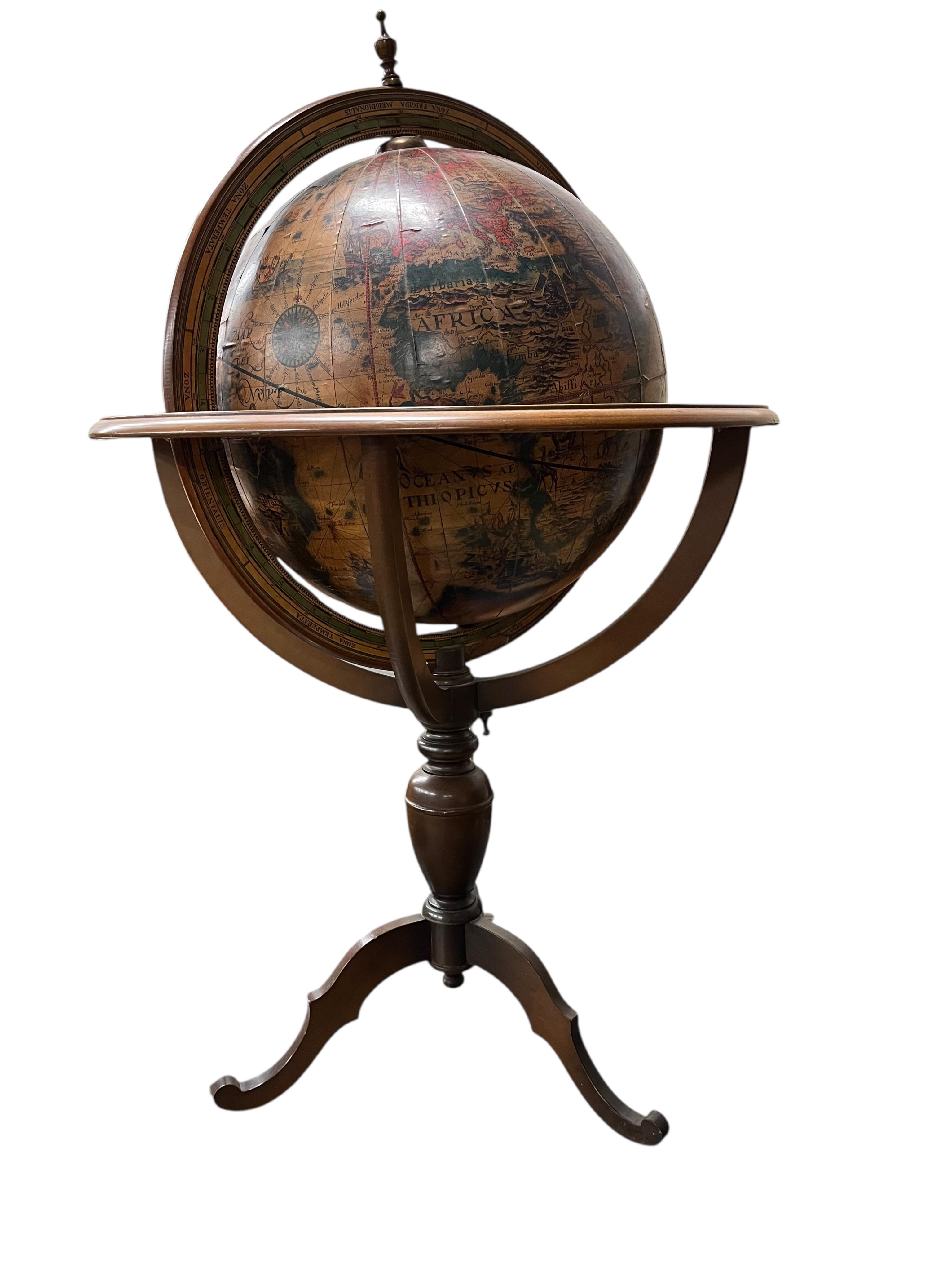 A reproduction terrestrial globe on beech tripod, height 118cm
